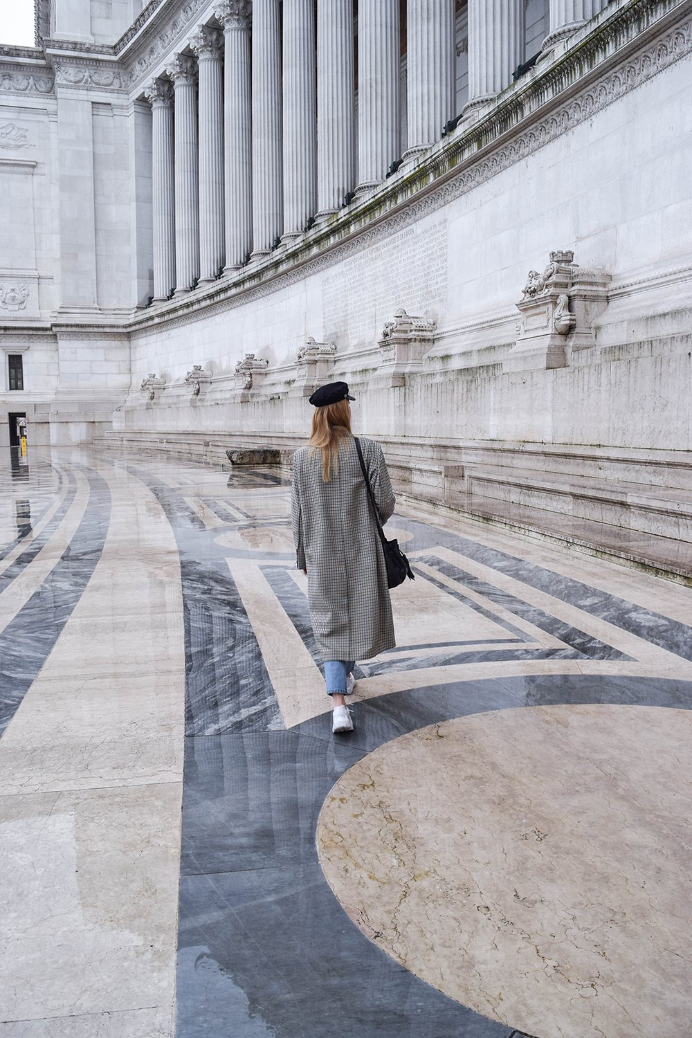 Girl with H&M checked coat in Vittorio Emanuele monument in Rome