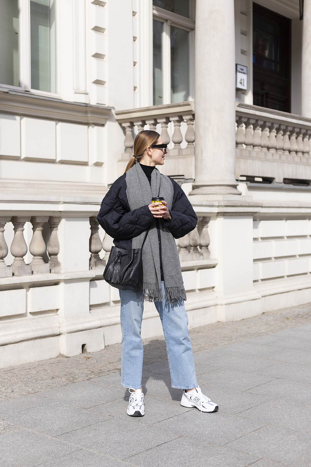 Athleisure street style quilted jacket and new balance sneakers 